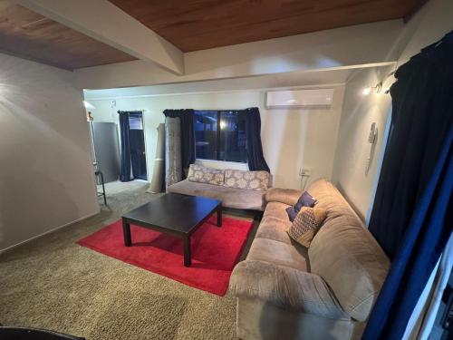 a living room with a couch and a coffee table at City holiday accommodation in Tauranga