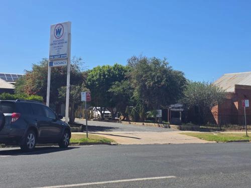 a car parked next to a no parking sign at Wentworth Central Motor Inn in Wentworth