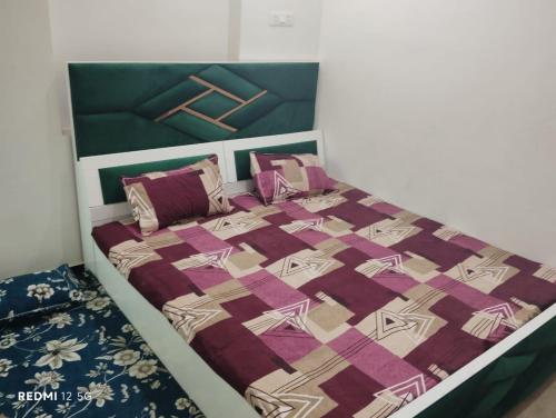 Postel nebo postele na pokoji v ubytování Shreeji Homestay