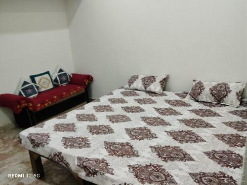 Postel nebo postele na pokoji v ubytování Shreeji Homestay