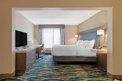 Ένα ή περισσότερα κρεβάτια σε δωμάτιο στο Comfort Inn & Suites Greenville Near Convention Center