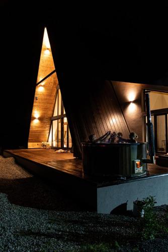 a building with a tub in the middle of it at Chalet Rafenstein in Moisei