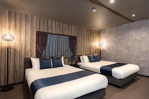 En eller flere senge i et værelse på JAPAVISTA Leggero