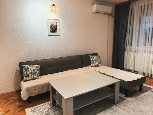 a living room with a couch and a table at Nana 1 in Strumica