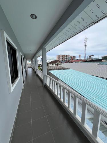 a view from the balcony of a house with a swimming pool at J2 Airport Mansion in Thalang