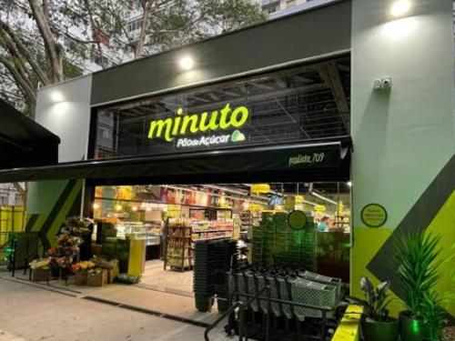 a store with a large sign on the front of it at Vila jequitimar in Guarujá