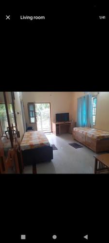 Ένα ή περισσότερα κρεβάτια σε δωμάτιο στο PARK VIEW In MYSORE CITY