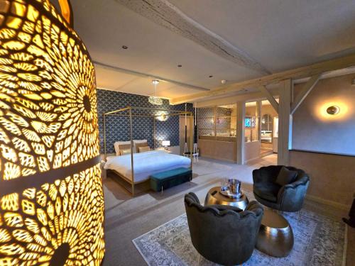 Ένα ή περισσότερα κρεβάτια σε δωμάτιο στο Le Clos des Thermes