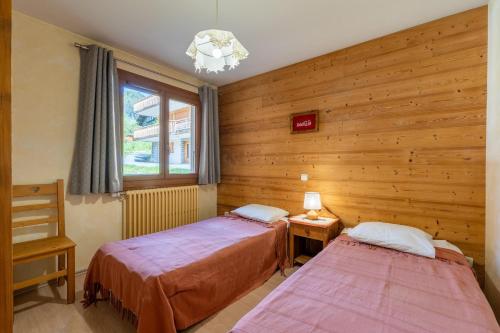 Llit o llits en una habitació de Deux Vallées 3