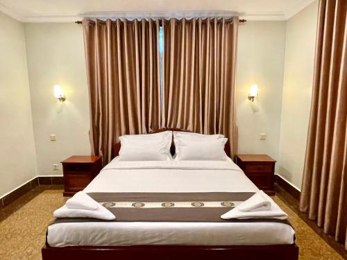 Ένα ή περισσότερα κρεβάτια σε δωμάτιο στο You Mean Heng Guesthouse