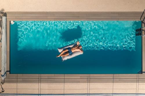 a painting of a diver in the water at Villa Chloé in Bordighera