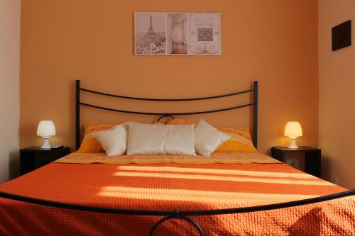Casa Vacanza Etna tesisinde bir odada yatak veya yataklar
