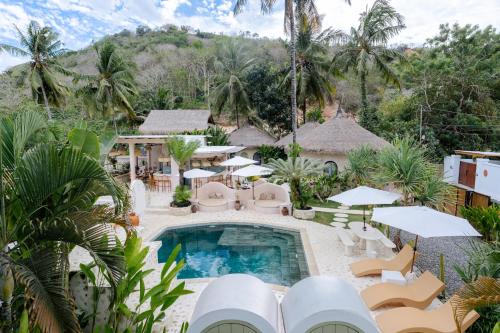 an aerial view of a resort with a swimming pool at Tiu Oasis Lombok in Kuta Lombok