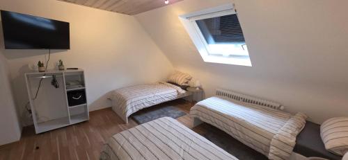 Postel nebo postele na pokoji v ubytování Ferienwohnung FeLu