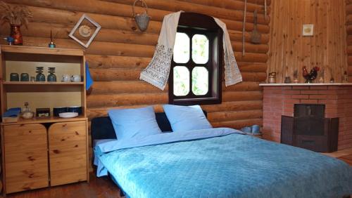 Ένα ή περισσότερα κρεβάτια σε δωμάτιο στο El Rancho De Stayki