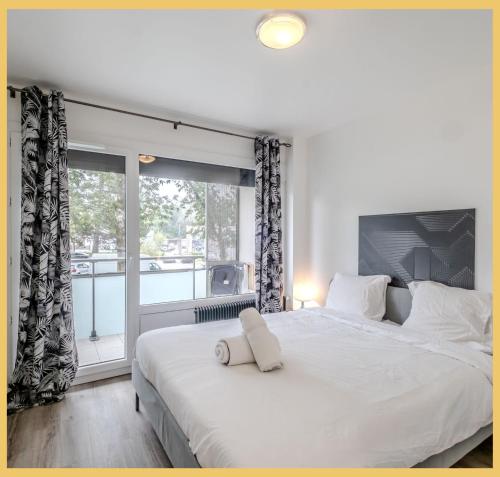 Ένα ή περισσότερα κρεβάτια σε δωμάτιο στο Chez Pat' I T2 I Saint-Julien