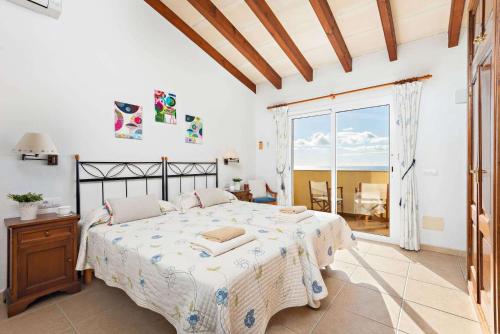 Ένα ή περισσότερα κρεβάτια σε δωμάτιο στο Villa Ebea