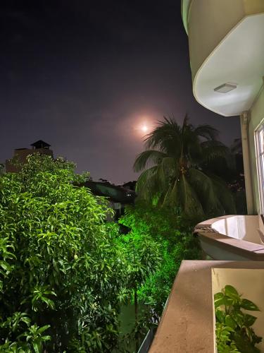 a view from the balcony of a house at night at Wellness Residencies in Colombo