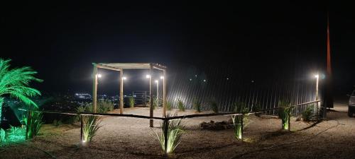 a park at night with lights on the ground at Cabana Vulcão em Andradas MG in Andradas