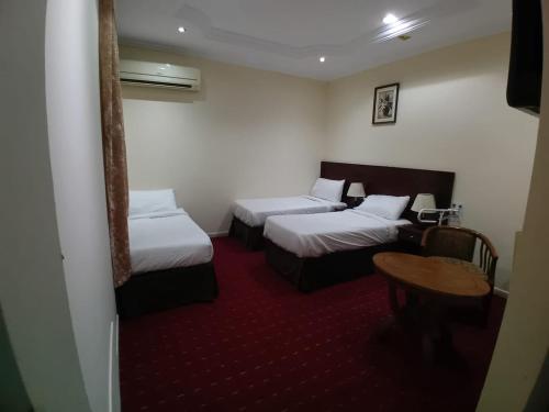 Postel nebo postele na pokoji v ubytování JOHRA MESSAT Hotel