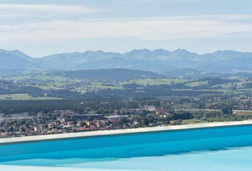 a view of a city and mountains from an airplane at Villa Revere - luksus w sercu Podhala in Nowy Targ