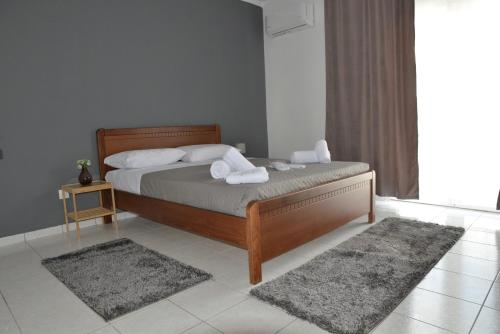 a bedroom with a bed with two towels on it at Bilalshome in Alexandroupoli