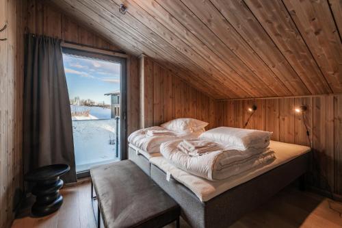 En eller flere senge i et værelse på Kikut Alpin Lodge 1302