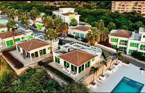 an aerial view of a house with a swimming pool at An oasis in the bay in Blue Bay