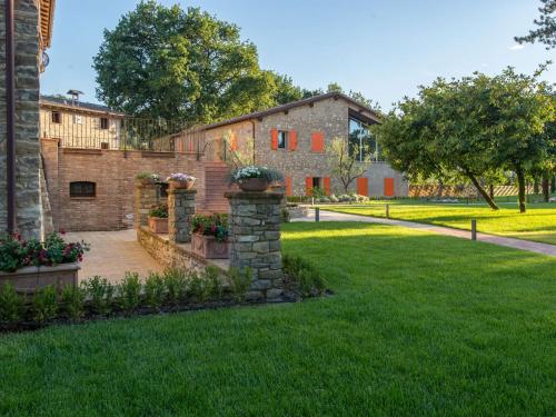 a garden in front of a brick building at Borgo Cadonega in Viano