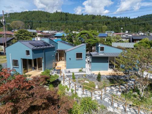 an aerial view of a blue house at Silver Daisy Stay Nikko in Nikko