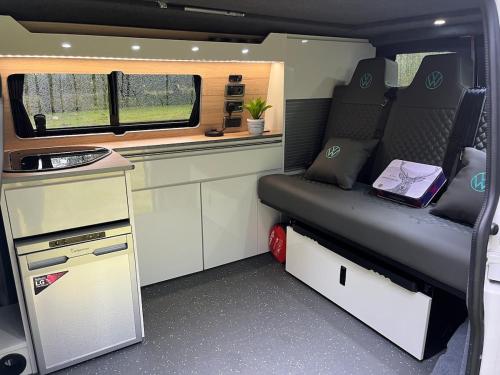 a small room with a bed in an rv at Campervan Scotland, Ben Roamer in Dunblane