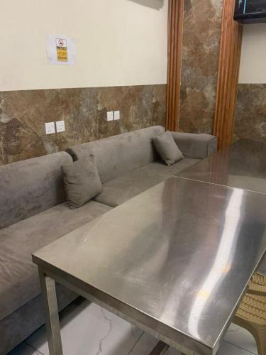 a living room with a couch and a table at رميدا 3 in Abha