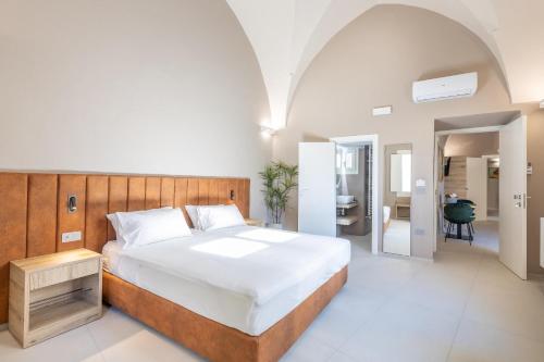 Ένα ή περισσότερα κρεβάτια σε δωμάτιο στο Dimora Del Centro