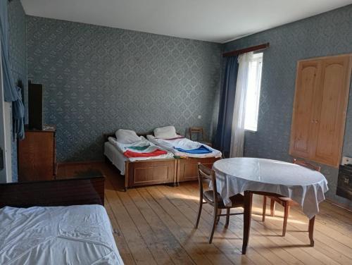 Ένα ή περισσότερα κρεβάτια σε δωμάτιο στο -L0RIA-Guest House