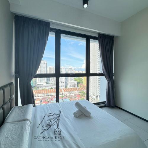 a bedroom with a bed and a large window at Urban Suites 2BR #SelfCheck-in #6Pax #TopFacilities in Jelutong