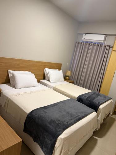 Postel nebo postele na pokoji v ubytování Tu lugar en Ciudad Del Este Dpto 301