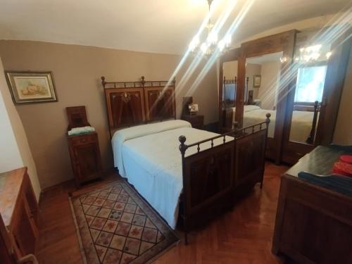 a bedroom with a bed and a large mirror at Il Borghetto in Villaretto