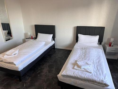 Ένα ή περισσότερα κρεβάτια σε δωμάτιο στο Alfa Hotel Frankfurt