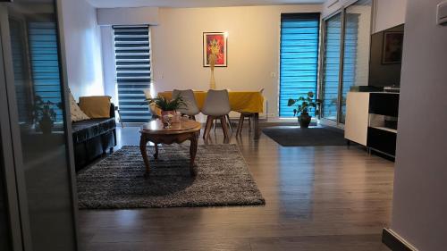 a living room with a couch and a table at Port Royal in Aix-en-Provence