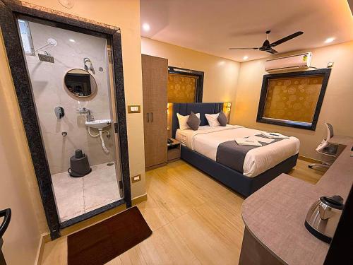 a hotel room with a bed and a shower at Mio Boutique Hotel - Just Launched in Hyderabad
