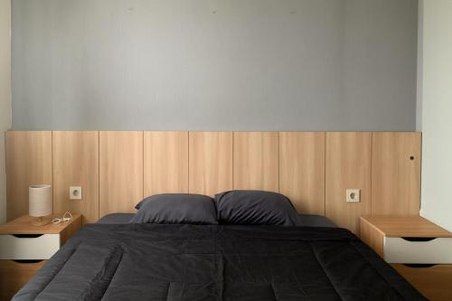 Ένα ή περισσότερα κρεβάτια σε δωμάτιο στο Apartement Cozy Bintaro Icon Emerald by alonelyroom