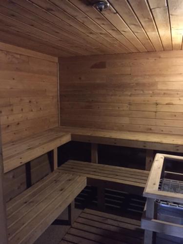 an empty sauna with wooden benches in a room at Paddle Wheel Inn in Oregon