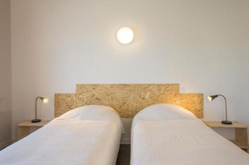 Ένα ή περισσότερα κρεβάτια σε δωμάτιο στο Gîte de la Gare 4