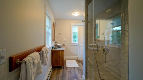 a bathroom with a shower with a glass shower stall at The Still Pond Inn in Still Pond