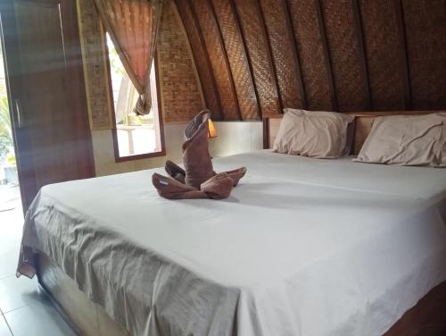 Кровать или кровати в номере Warna Cottage