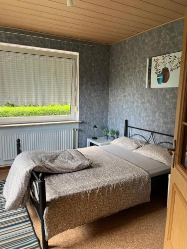 Una cama o camas en una habitación de Ferienhaus in Ostfriesland