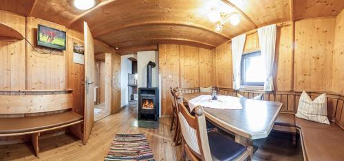 a kitchen with a table and a stove in a room at Otto&#039s Skihütte in Sölden