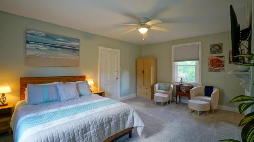 a bedroom with a bed and a table and chairs at The Still Pond Inn in Still Pond