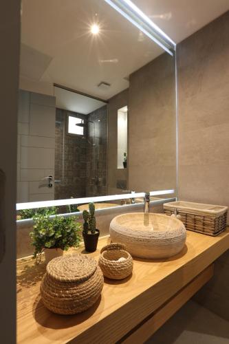 a bathroom with a sink and a mirror at YMY Beach House in Agadir