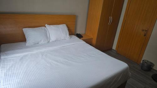 Postel nebo postele na pokoji v ubytování Camas Inn Opako Abeokuta
